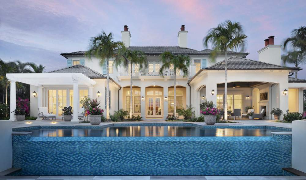 Beautiful white house with columns situated on an island