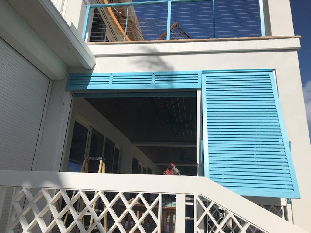 Aqua blue open bahama shutters