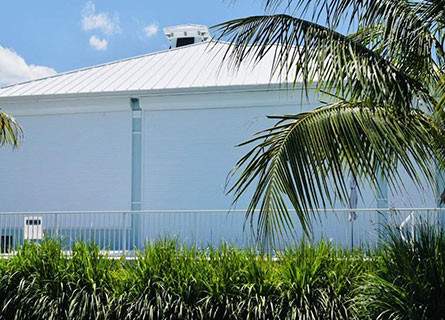 Roll down shutters on light blue house