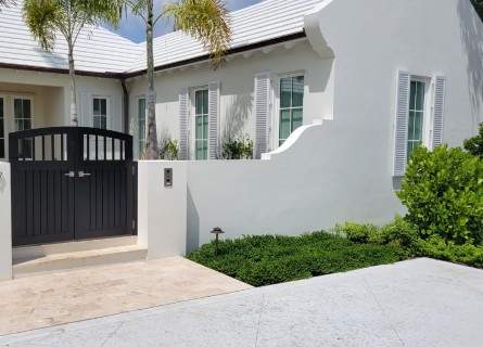 focal Custom fabricated brown gate leading to a courtyard 445x320